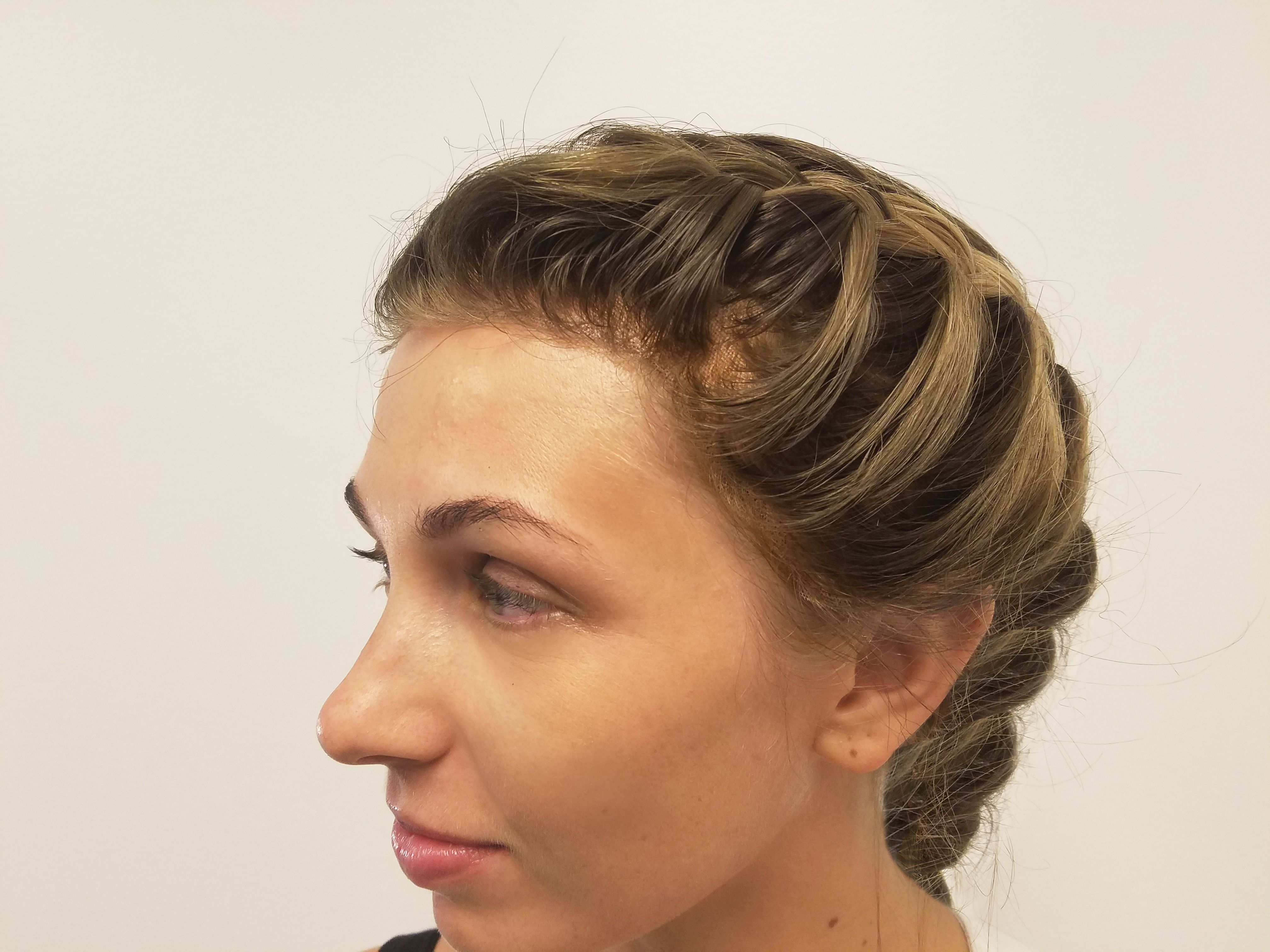 Profile view of styled/braided wig.